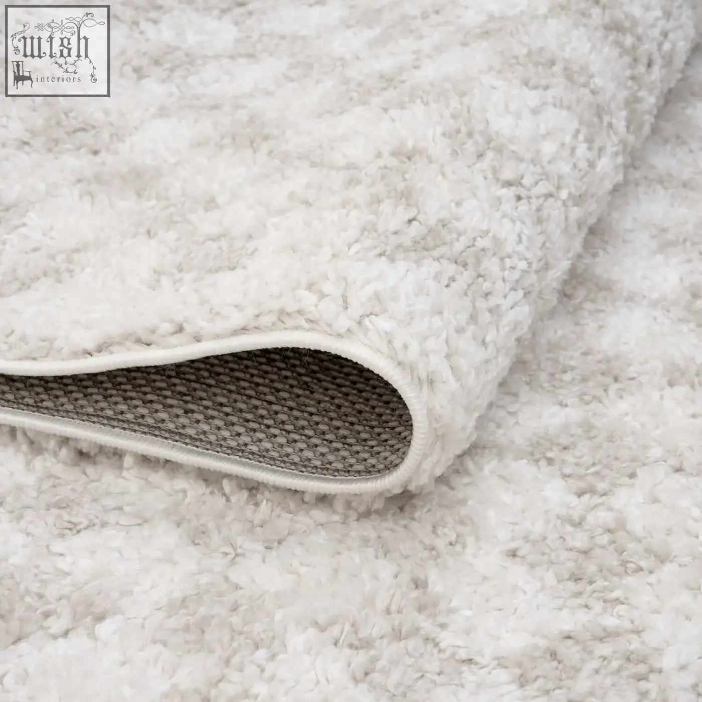 A moodi shaggy light beige rug with off-white plush shaggy texture and neatly finished edges for cozy decor