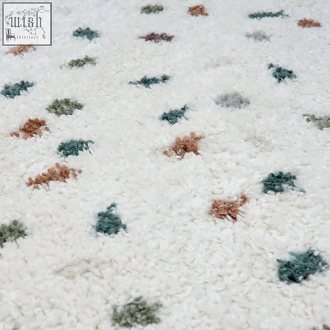 White plush moodi shaggy multicolour rug with green brown and gray tufts perfect for cozy spaces