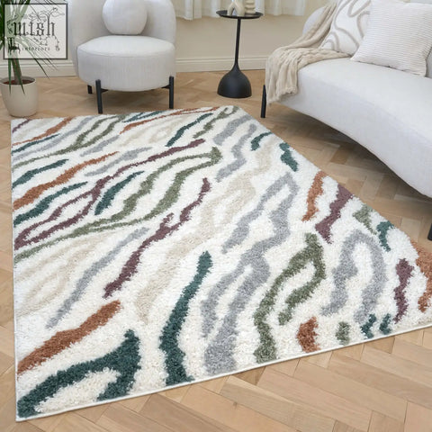 A plush rectangular moodi shaggy multicolour tidecrest rug with shaggy texture and wavy stripes in earthy tones