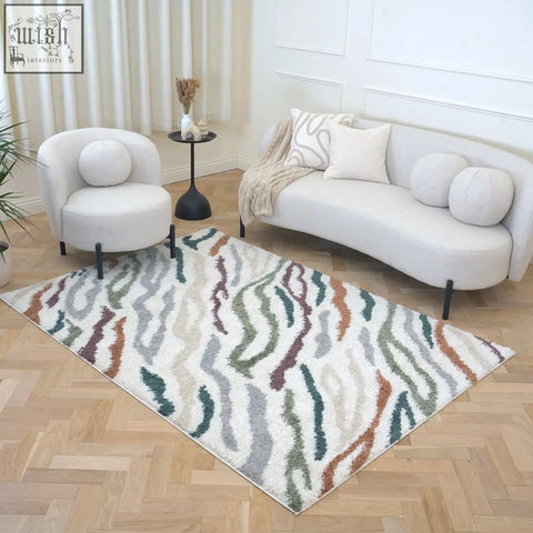 A rectangular moodi shaggy multicolour tidecrest rug with plush shaggy texture and abstract wavy earth tones design