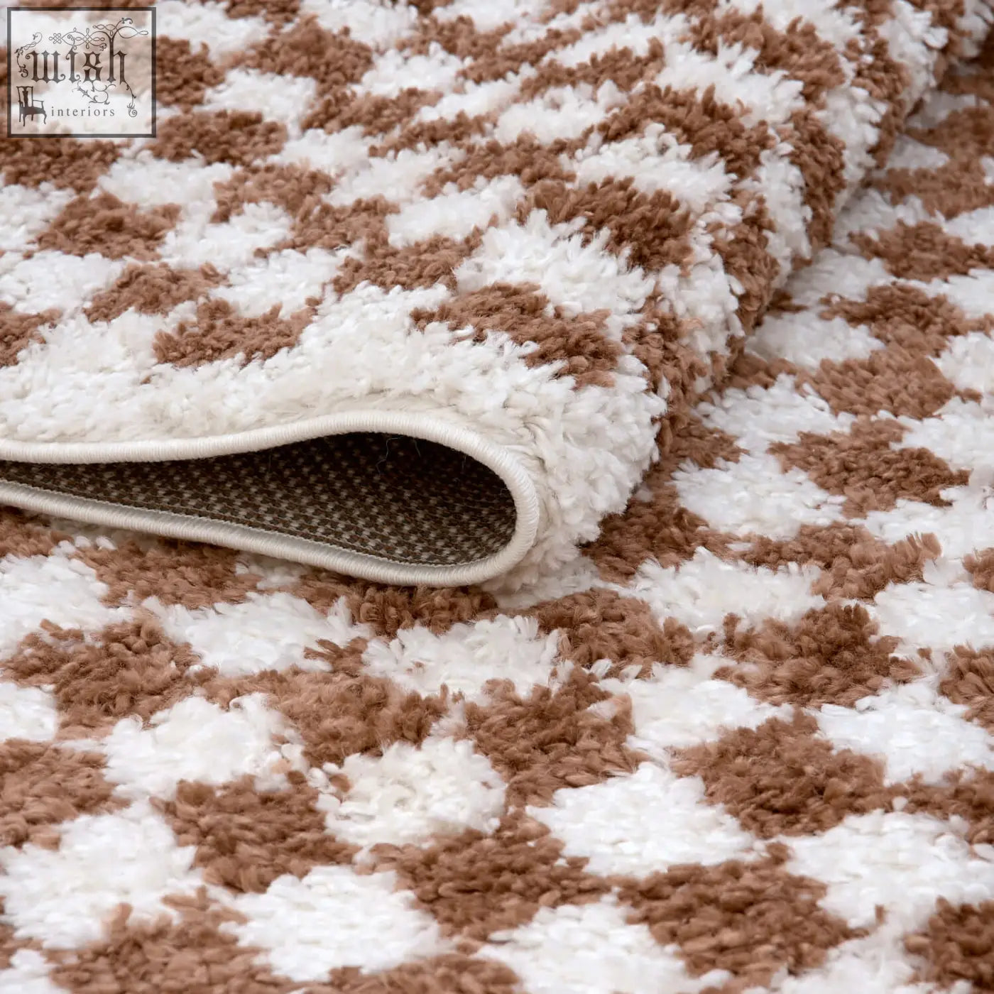 A plush cream and brown houndstooth bath mat with soft shaggy texture from moodi shaggy terra pixelate rug collection