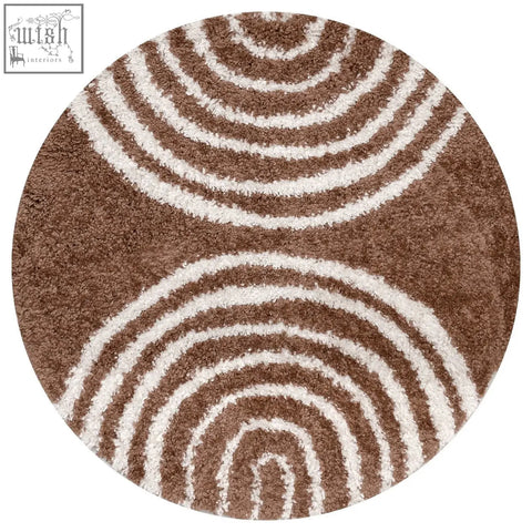 Brown and white circular moodi shaggy terra rug with plush concentric stripes and soft shaggy texture terra tawny rug
