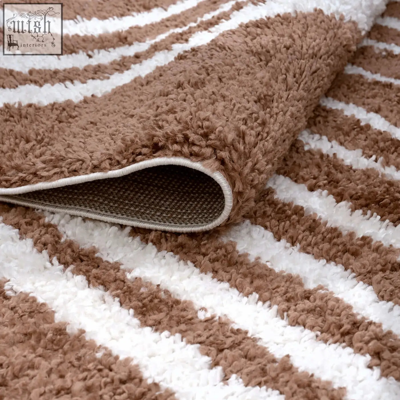 A plush moodi shaggy terra tawny rug with brown and white stripes and a soft shaggy texture perfect for bathrooms