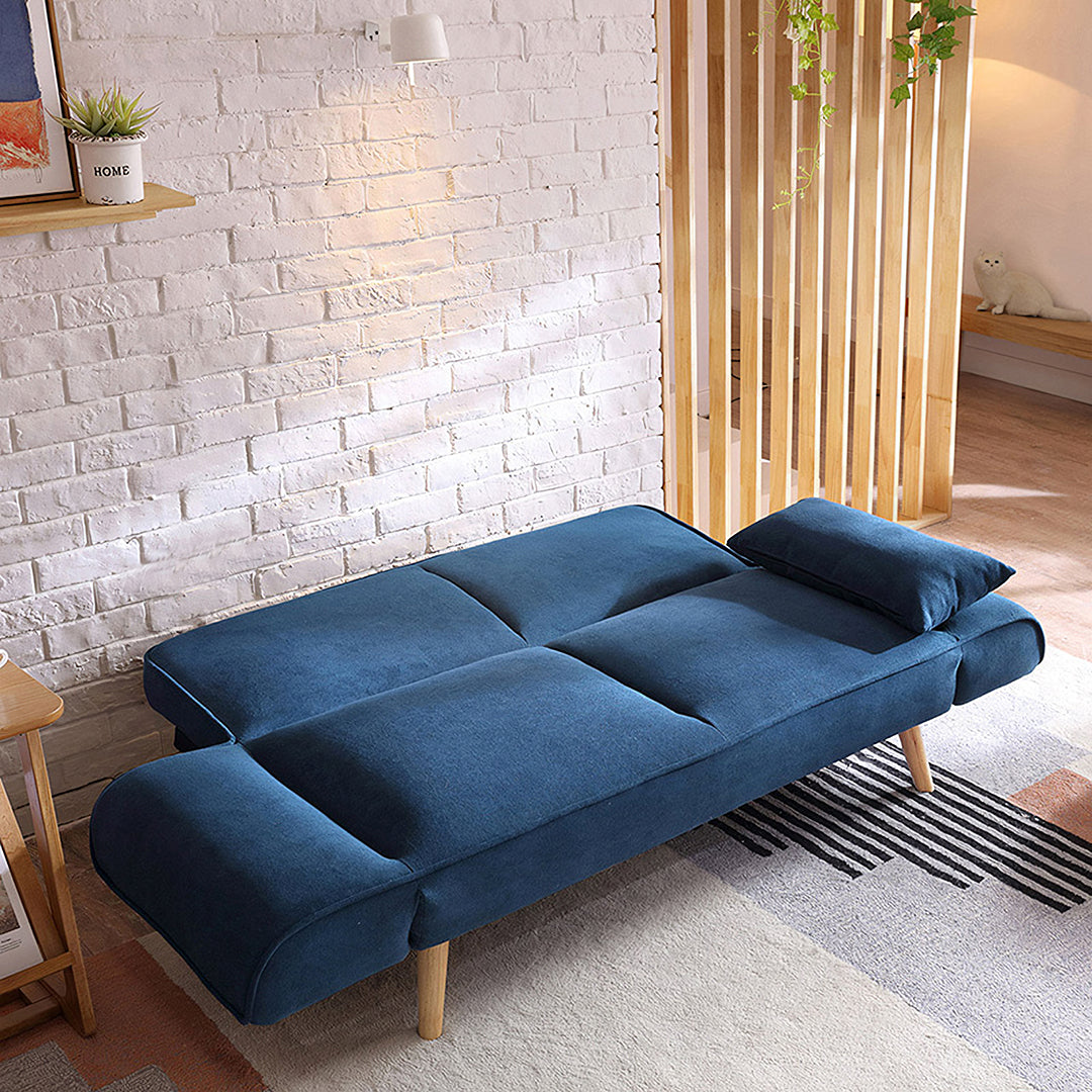 Deep blue velvet morales foldable sofa bed with wooden legs and matching pillows ideal as a kid sofa bed