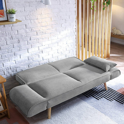 Gray upholstered Morales foldable sofa bed with wooden legs and matching pillow ideal as a kid sofa bed