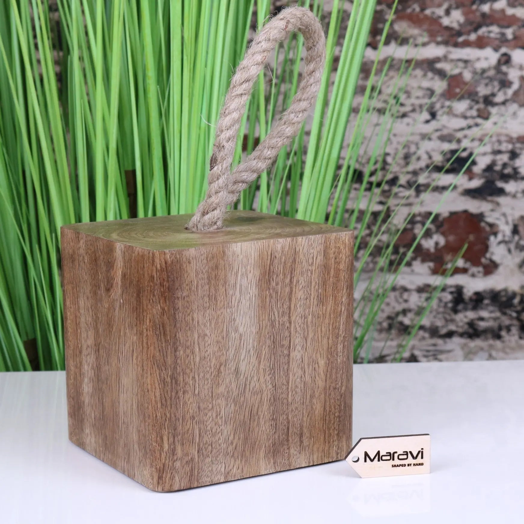 Handcrafted mori wooden door stop with natural brown finish and thick beige rope handle for secure door holding