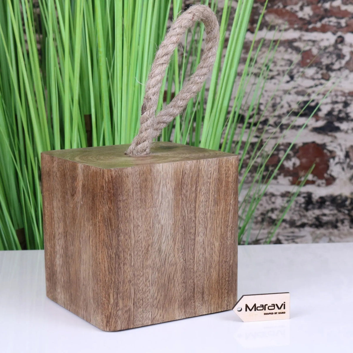 Handcrafted mori wooden door stop with natural brown finish and thick beige rope handle for secure door holding