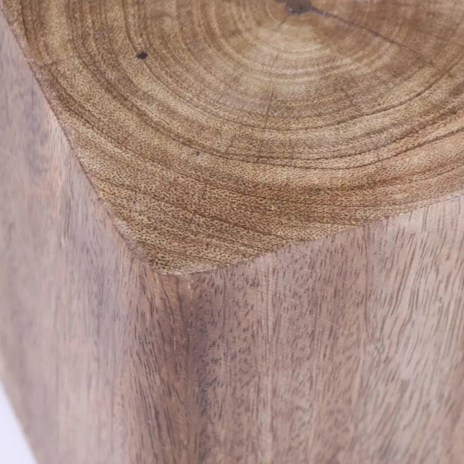 A rustic light brown wooden door stop with natural grain and circular growth rings for mori wooden door use