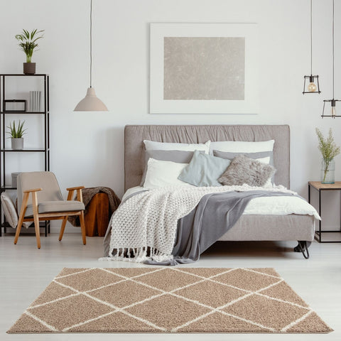 Moroccan beige shaggy rug featuring a beige shaggy texture with a cream-colored geometric diamond pattern