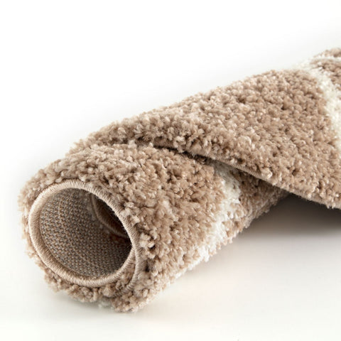 A plush moroccan beige shaggy rug with beige and white stripes and a soft textured surface perfect for any room