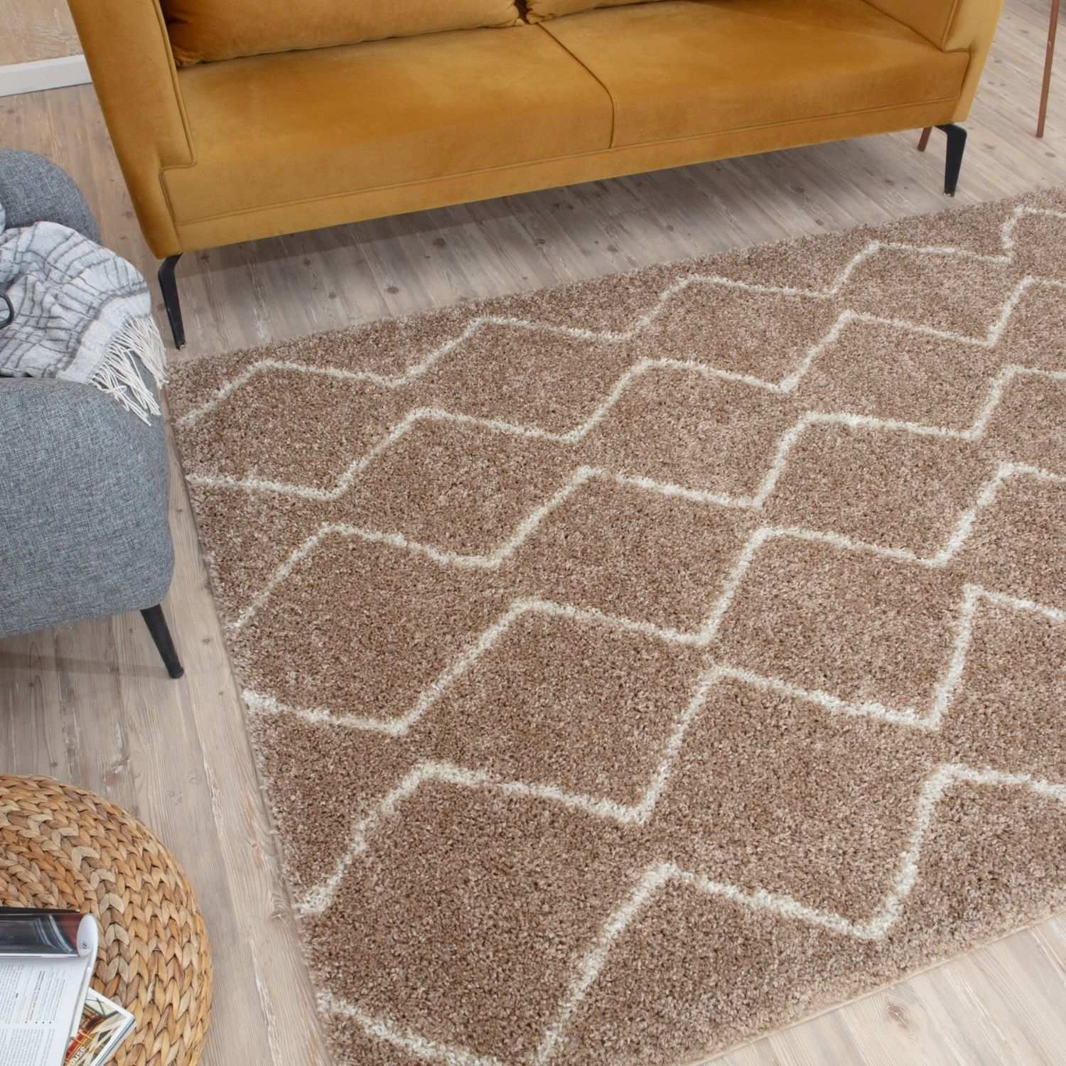 A moroccan beige shaggy rug with a plush brown base and cream geometric diamond pattern for cozy decor