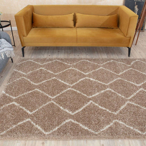 A moroccan beige shaggy rug with a plush beige base and cream geometric diamond pattern perfect for cozy spaces