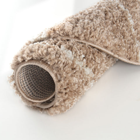 A moroccan beige shaggy rug with a plush textured surface and woven backing in soft beige tones