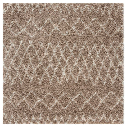 A plush moroccan beige shaggy rug with a soft textured surface and intricate lighter beige geometric pattern