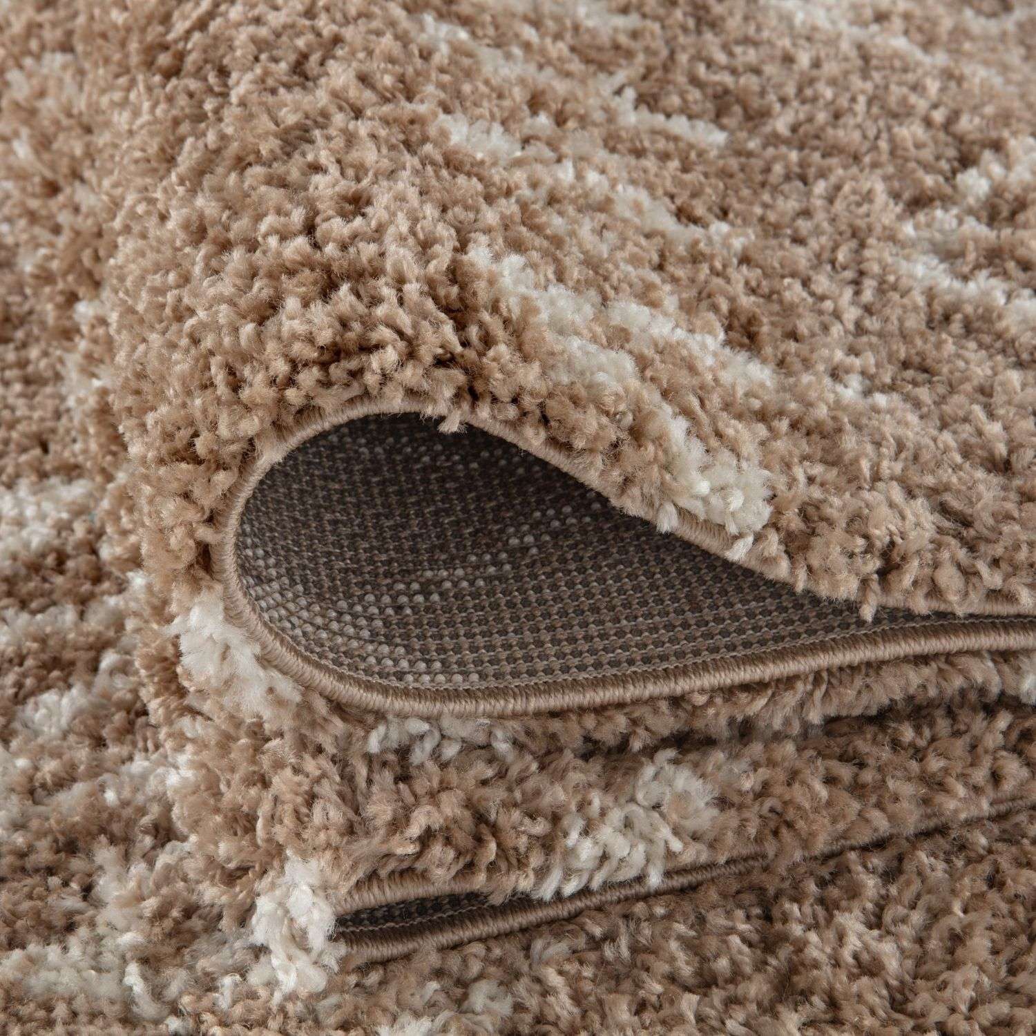 A moroccan beige shaggy rug with a plush textured surface in beige and cream perfect for cozy spaces
