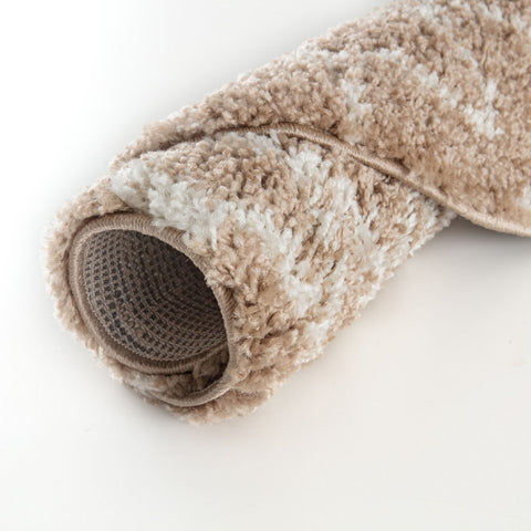A plush moroccan beige shaggy rug with a soft textured surface in beige and white perfect for cozy spaces