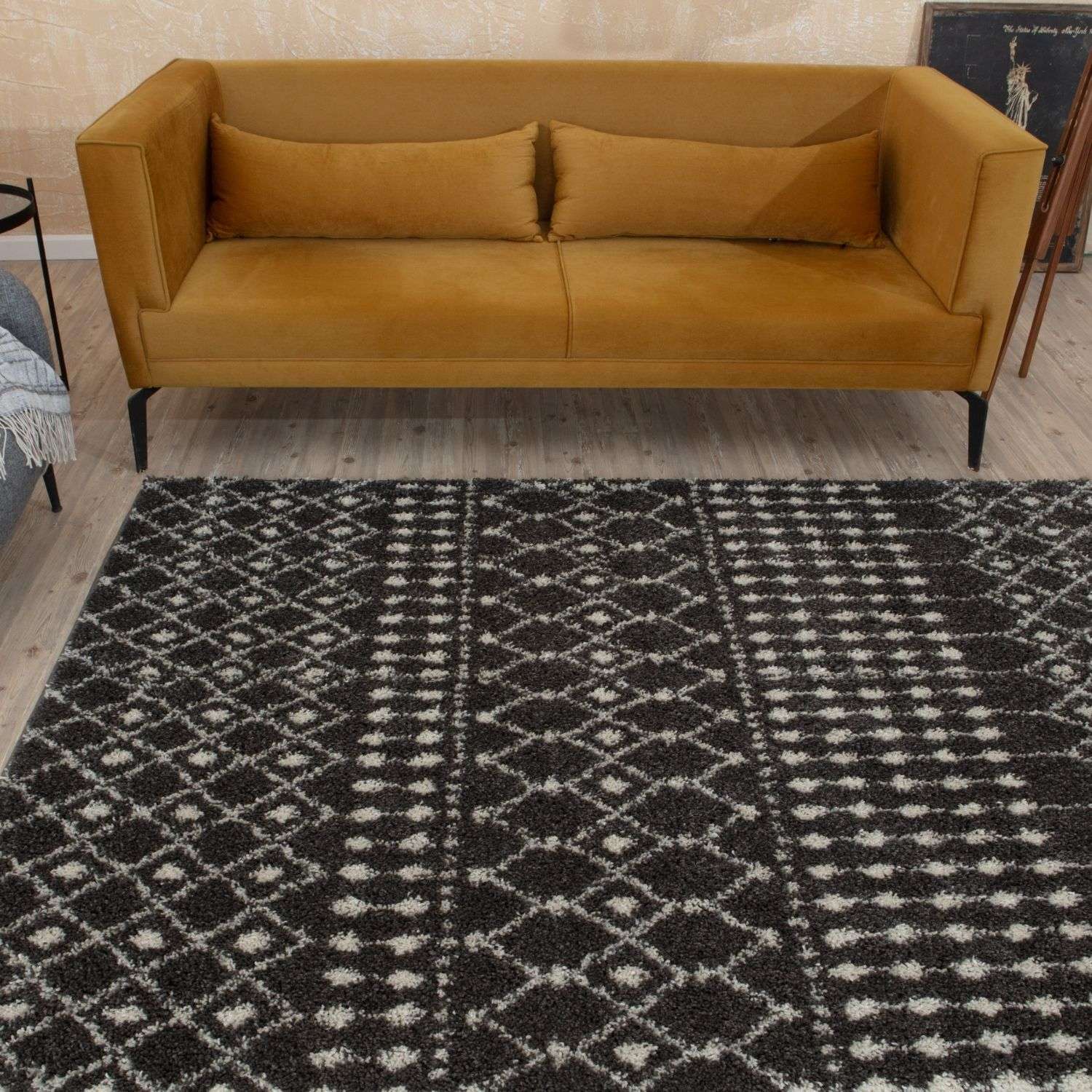 A plush black and white geometric moroccan dark grey shaggy rug with a soft texture perfect for cozy spaces