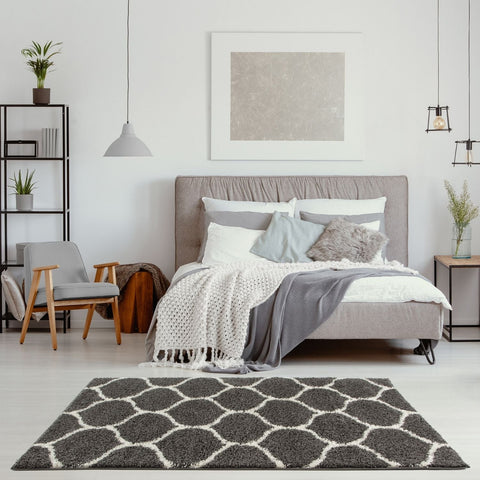 Gray and white geometric patterned moroccan dark grey shaggy area rug with soft texture for cozy living spaces