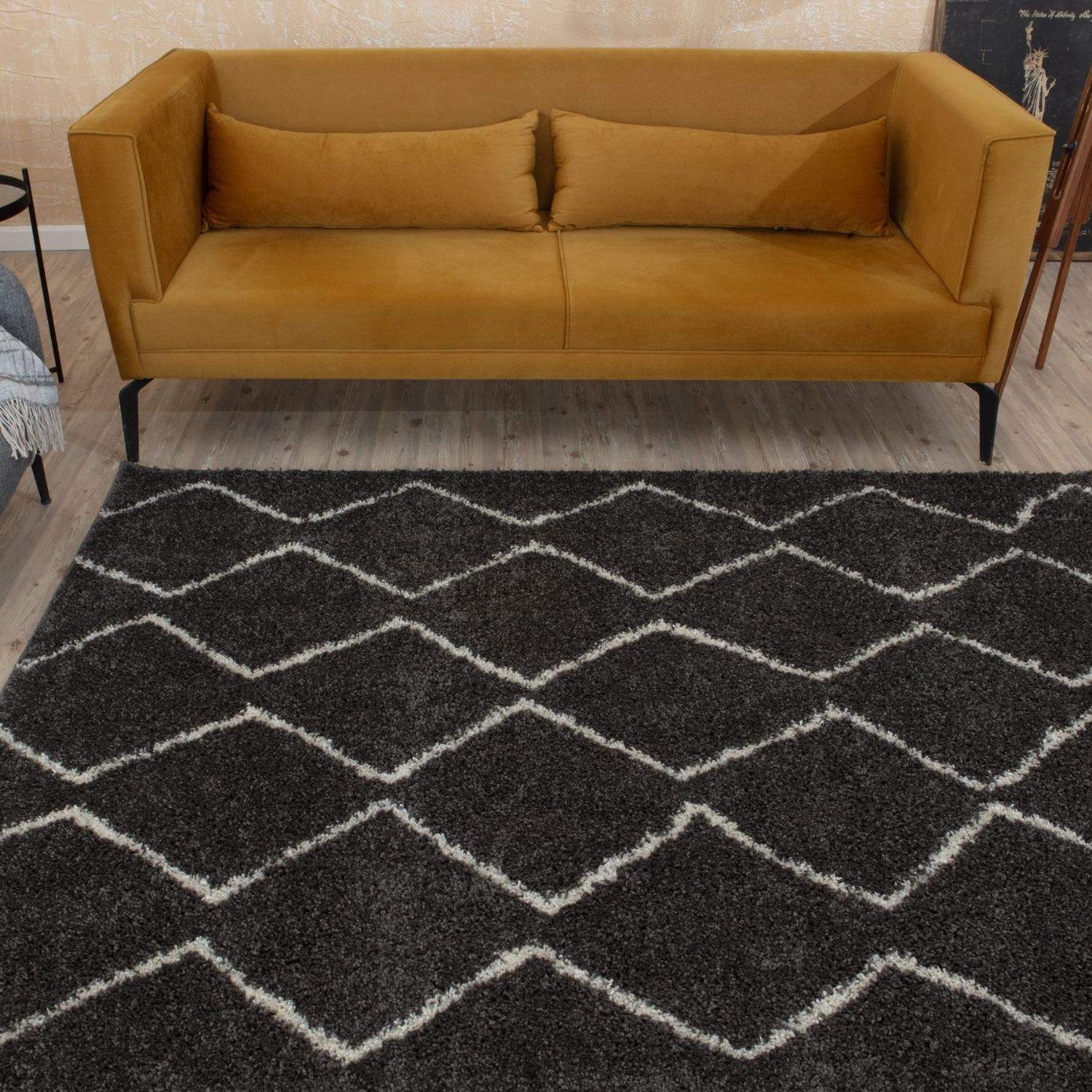 Moroccan dark grey shaggy rug with bold white geometric diamond pattern for a stylish cozy space