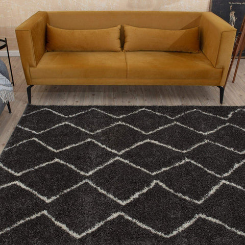 Moroccan dark grey shaggy rug with bold white geometric diamond pattern for a stylish cozy space