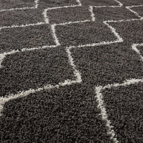 Moroccan dark grey shaggy rug with a geometric pattern of white fluffy lines forming interconnected squares