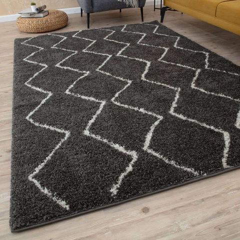 Moroccan dark grey shaggy rug with a soft texture and white zigzag geometric pattern for cozy living spaces