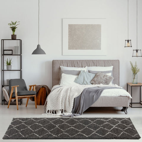 Gray shaggy rug with white geometric diamond pattern in moroccan dark grey shaggy style perfect for living spaces