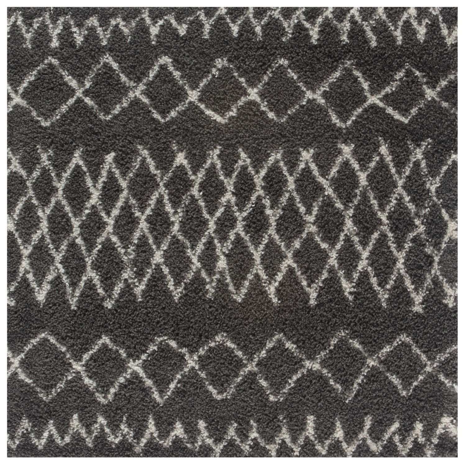 Moroccan dark grey shaggy rug with plush textured surface and white geometric diamond zigzag pattern