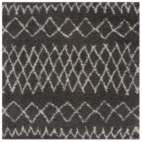 Moroccan dark grey shaggy rug with plush textured surface and white geometric diamond zigzag pattern
