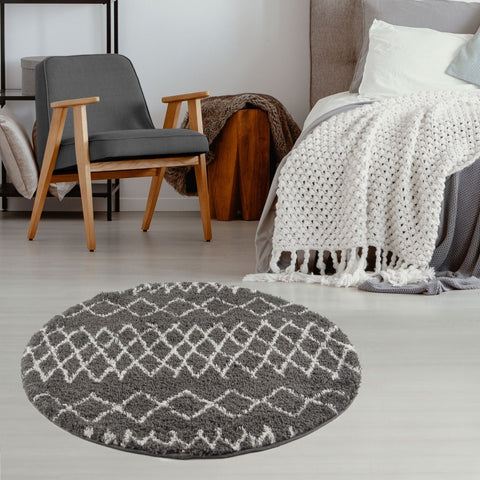 Gray circular moroccan dark grey shaggy rug with white geometric diamond pattern and plush texture