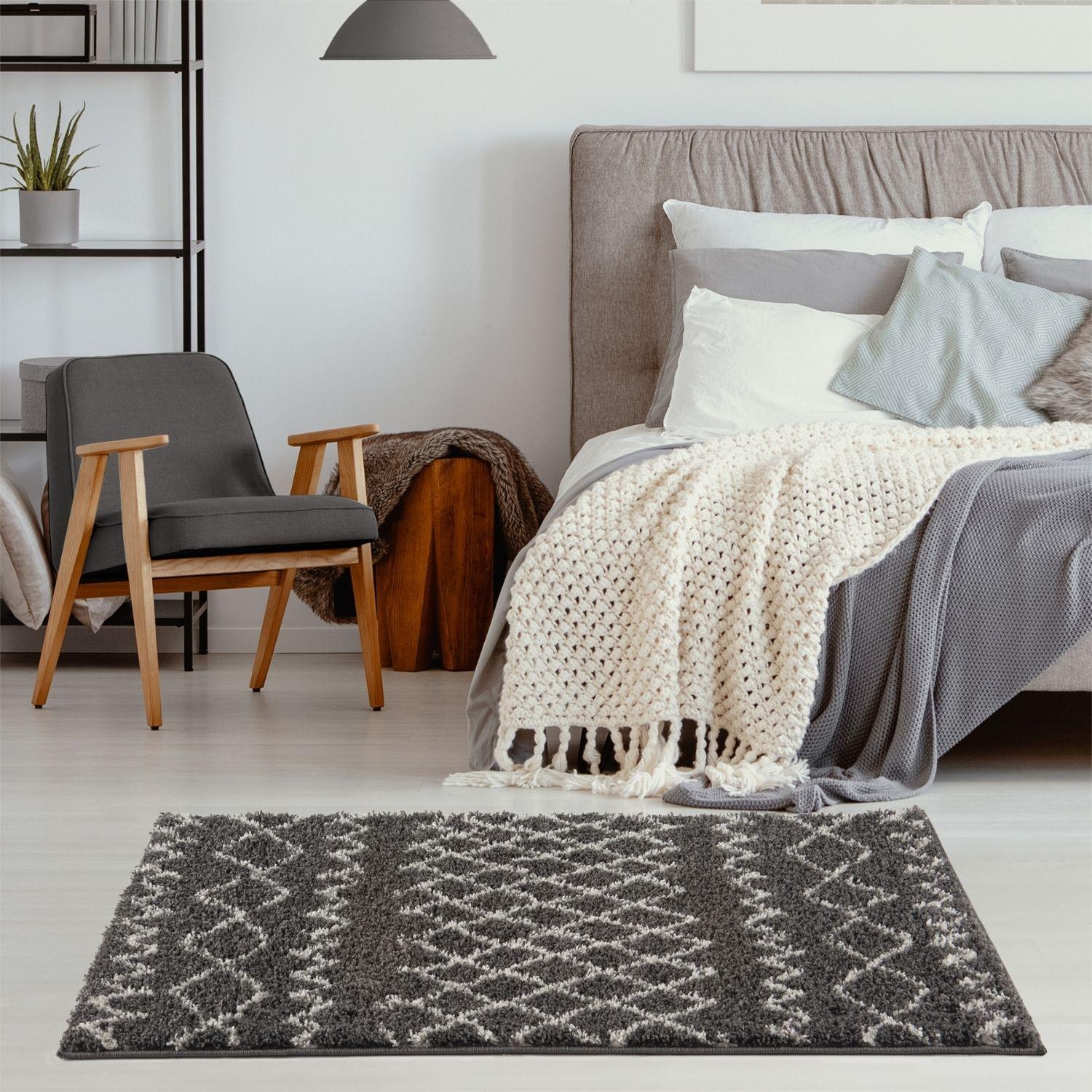 Moroccan dark grey shaggy rug with a plush textured surface and geometric grey and white pattern