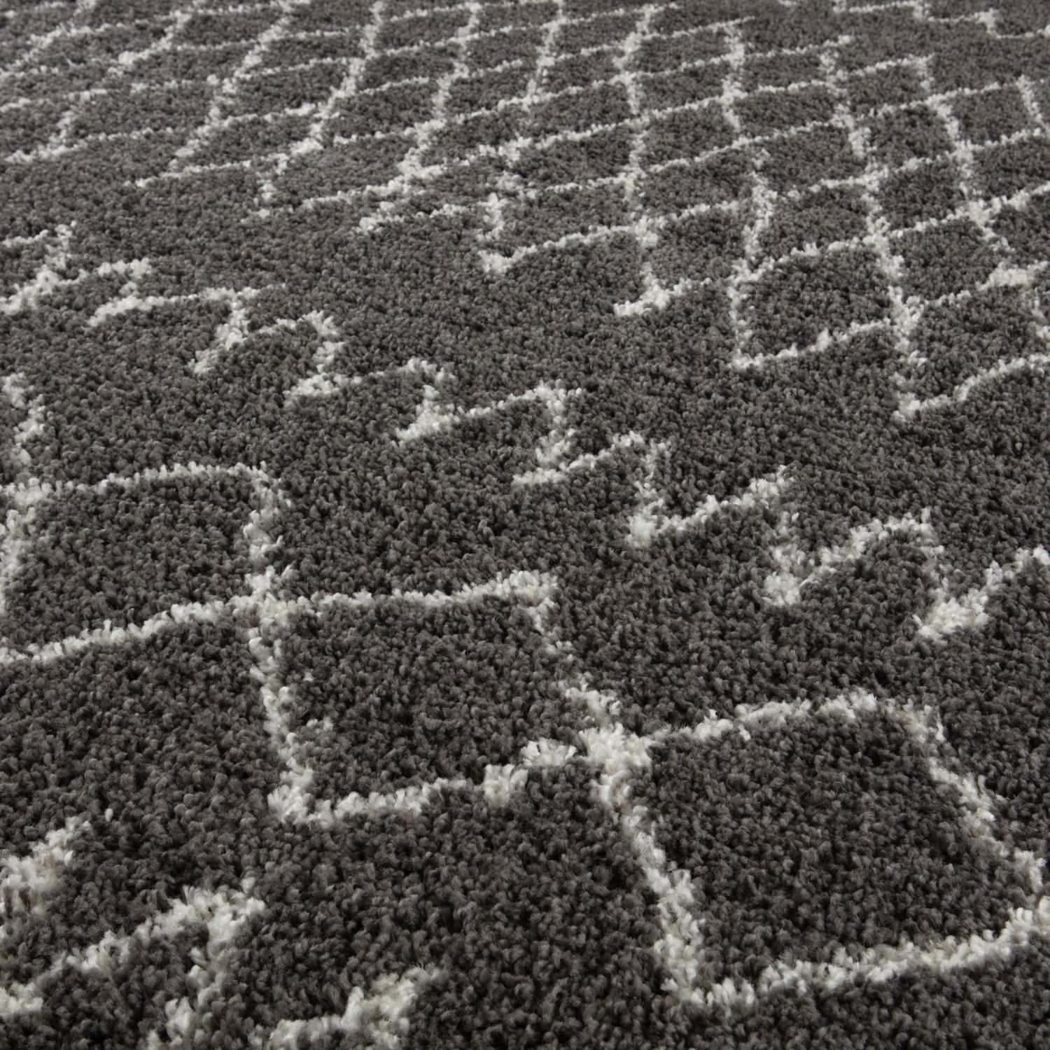 Moroccan dark grey shaggy rug with grey and white geometric pattern perfect as a cozy dark grey shaggy carpet