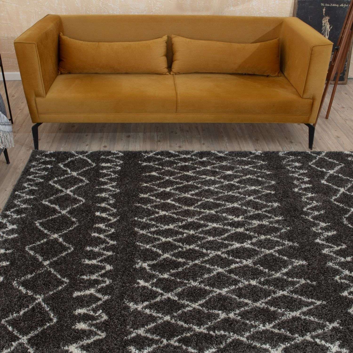 A plush moroccan dark grey shaggy rug with a black and white geometric pattern perfect for cozy spaces