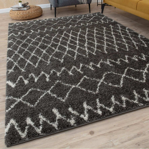 Moroccan dark grey shaggy rug with white geometric diamond and zigzag pattern made of soft plush material