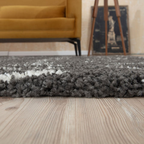 A plush moroccan dark grey shaggy rug with a fluffy textured surface perfect for cozy home decor