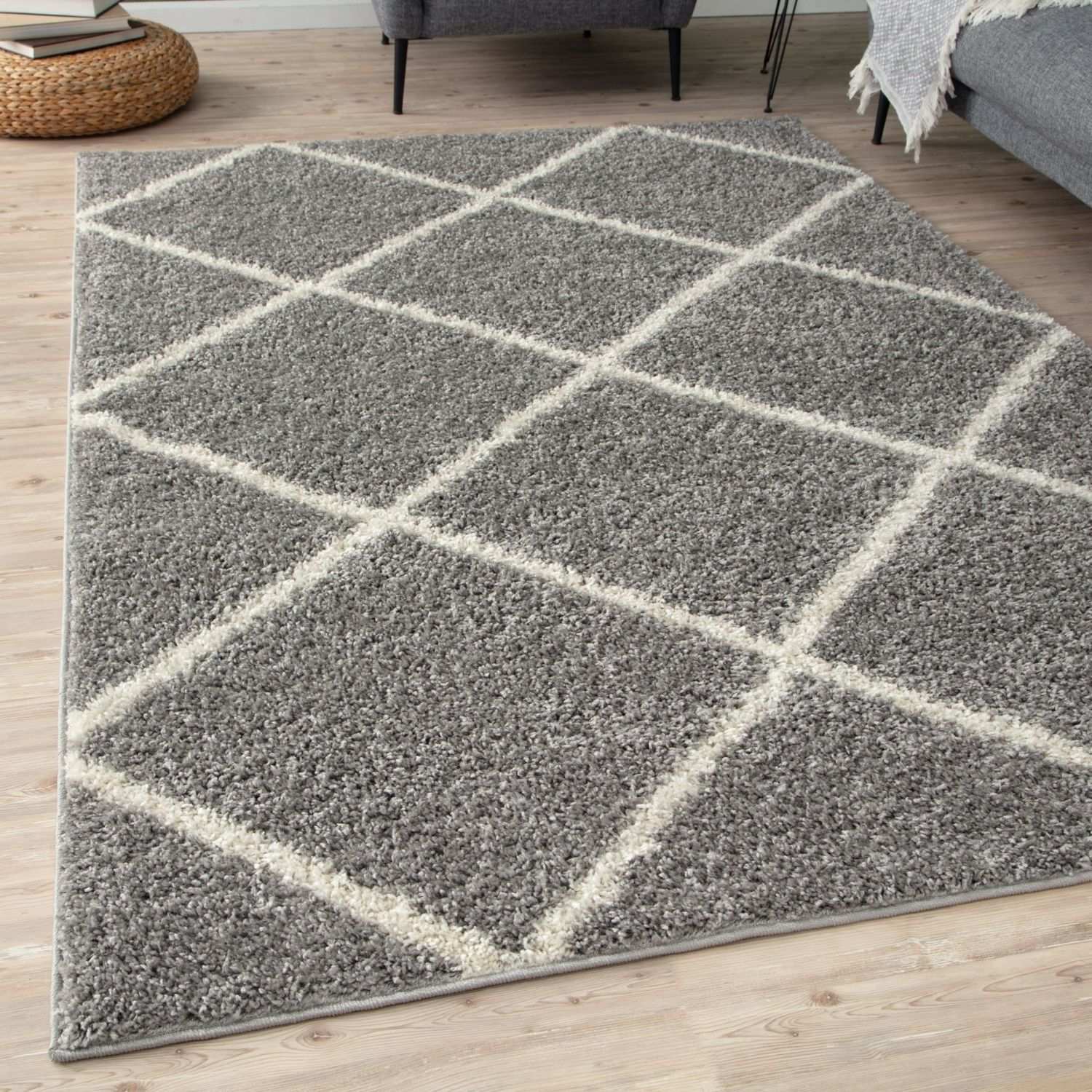 Moroccan grey shaggy area rug with a grey shaggy texture and geometric diamond pattern outlined in cream yarn