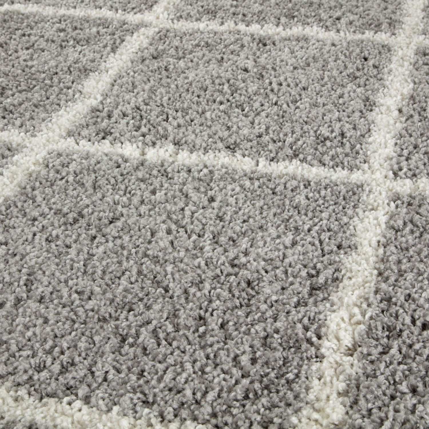 Moroccan grey shaggy rug with soft textured plush surface and white geometric grid pattern in grey shaggy rug style