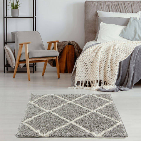 Moroccan grey shaggy rug with soft grey shaggy texture and white diamond pattern for cozy living spaces