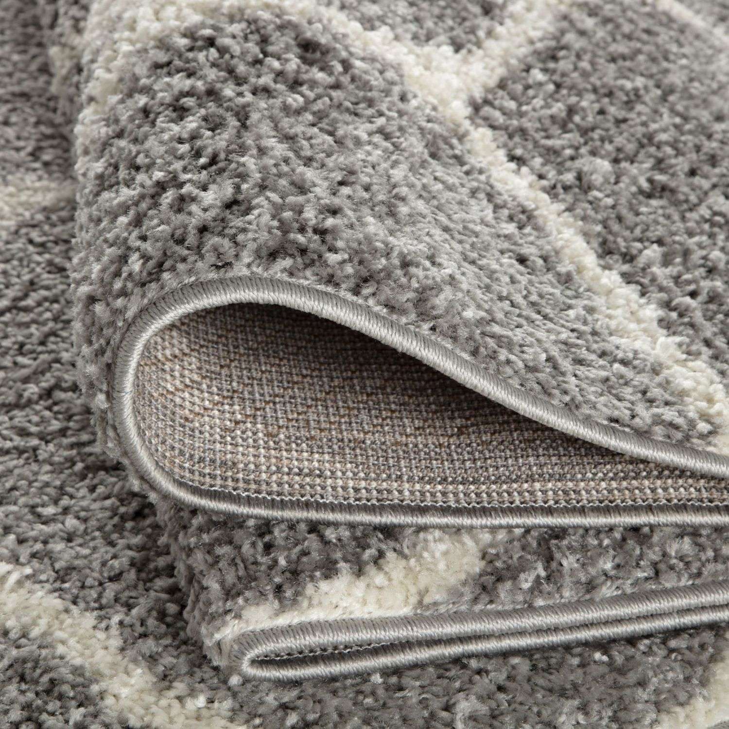 Moroccan grey shaggy rug with soft plush texture gray and white colors and neatly finished edges for cozy spaces
