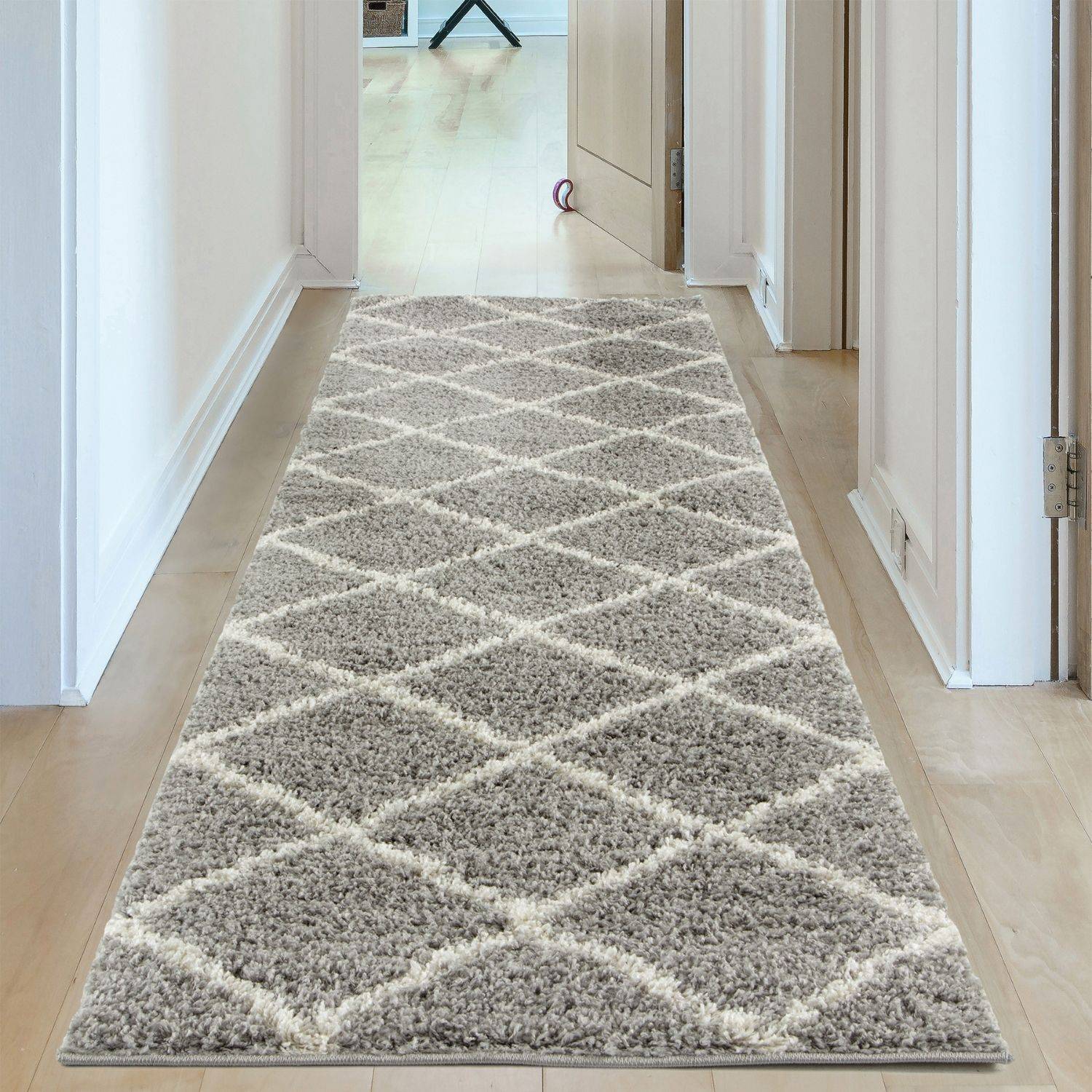 A plush moroccan grey shaggy runner rug with cream diamond pattern and soft shaggy texture perfect for cozy spaces
