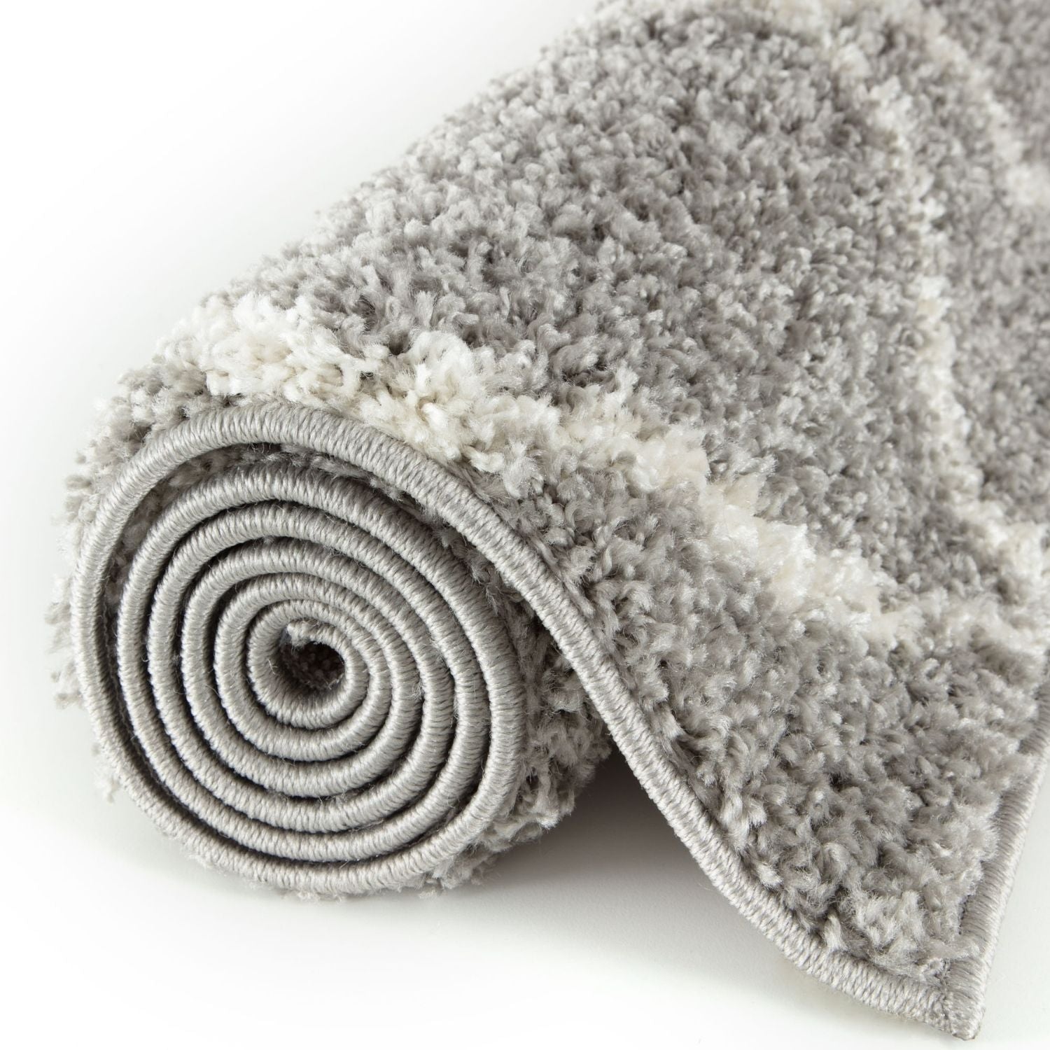 A plush moroccan grey shaggy rug with rolled edges and a soft textured surface perfect for cozy spaces