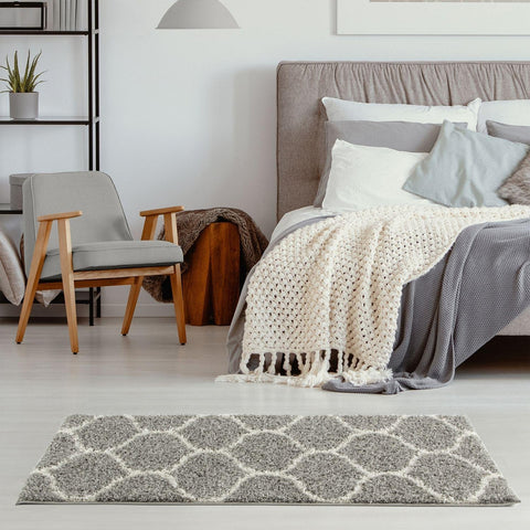 Moroccan grey shaggy rug with a cream geometric pattern adds cozy style to any room