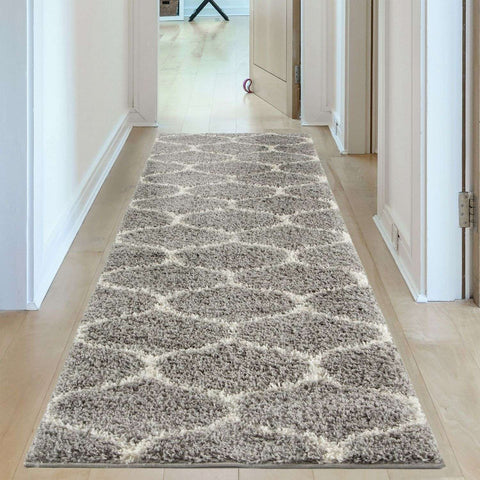 A plush moroccan grey shaggy hallway rug with cream geometric patterns and a soft textured pile