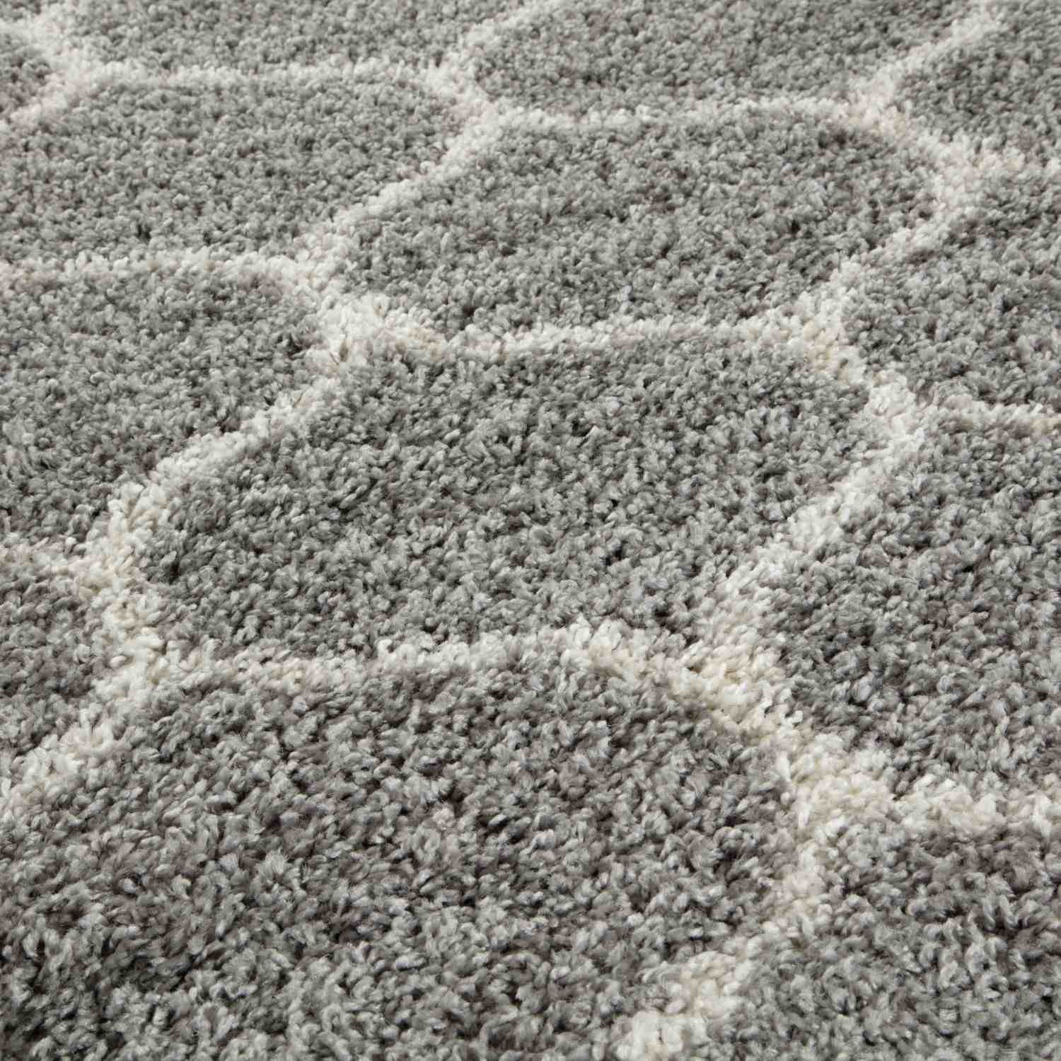 A plush moroccan grey shaggy rug with a soft textured surface and geometric grey and white pattern