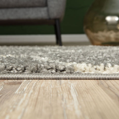 A moroccan grey shaggy rug with a plush grey and white textured soft shaggy pile perfect for cozy spaces