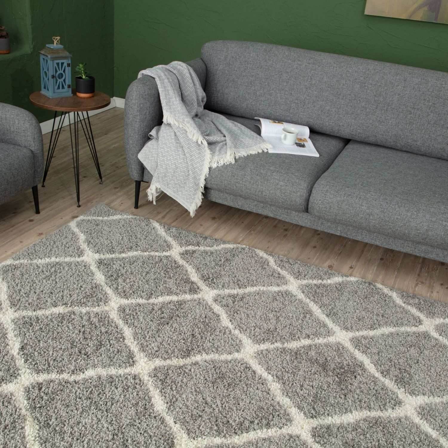 A moroccan grey shaggy rug with plush grey texture and cream diamond pattern perfect for cozy home spaces