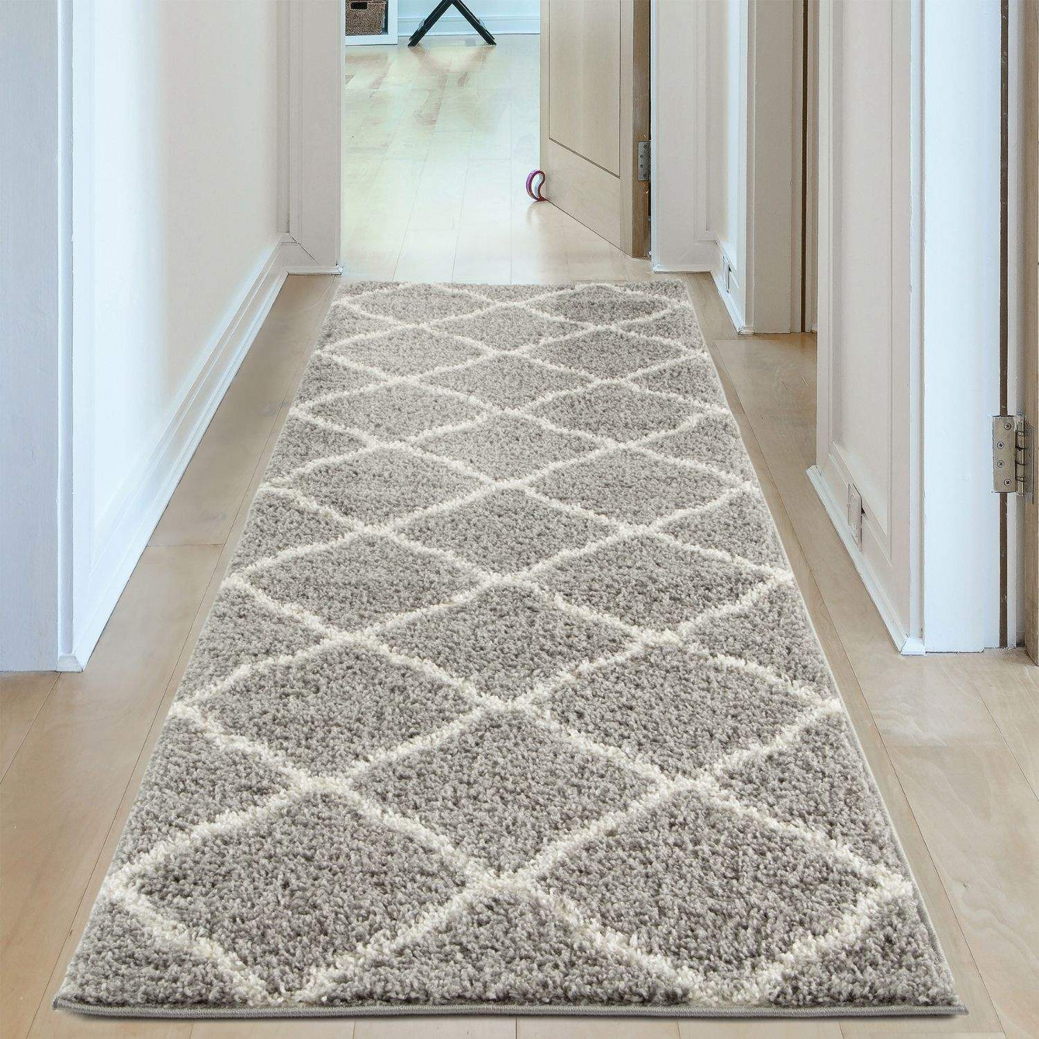 A plush moroccan grey shaggy rug with diamond pattern in grey and cream perfect for cozy living spaces