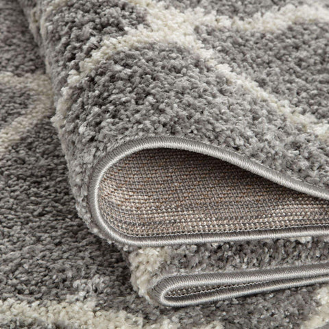 A plush moroccan grey shaggy rug with soft textured surface and neatly finished edges perfect for cozy spaces