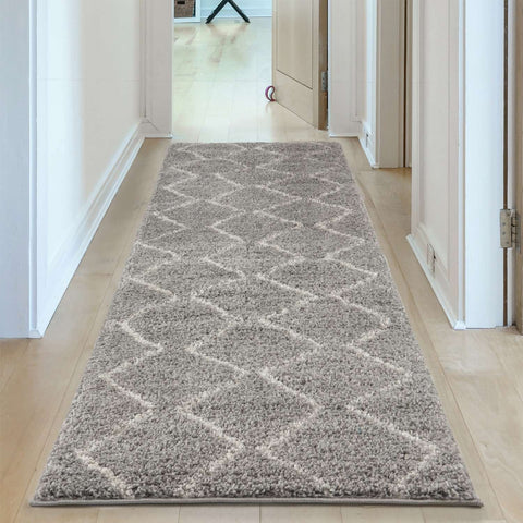 A moroccan grey shaggy runner rug with a plush gray shaggy texture and subtle cream diamond pattern perfect for home decor
