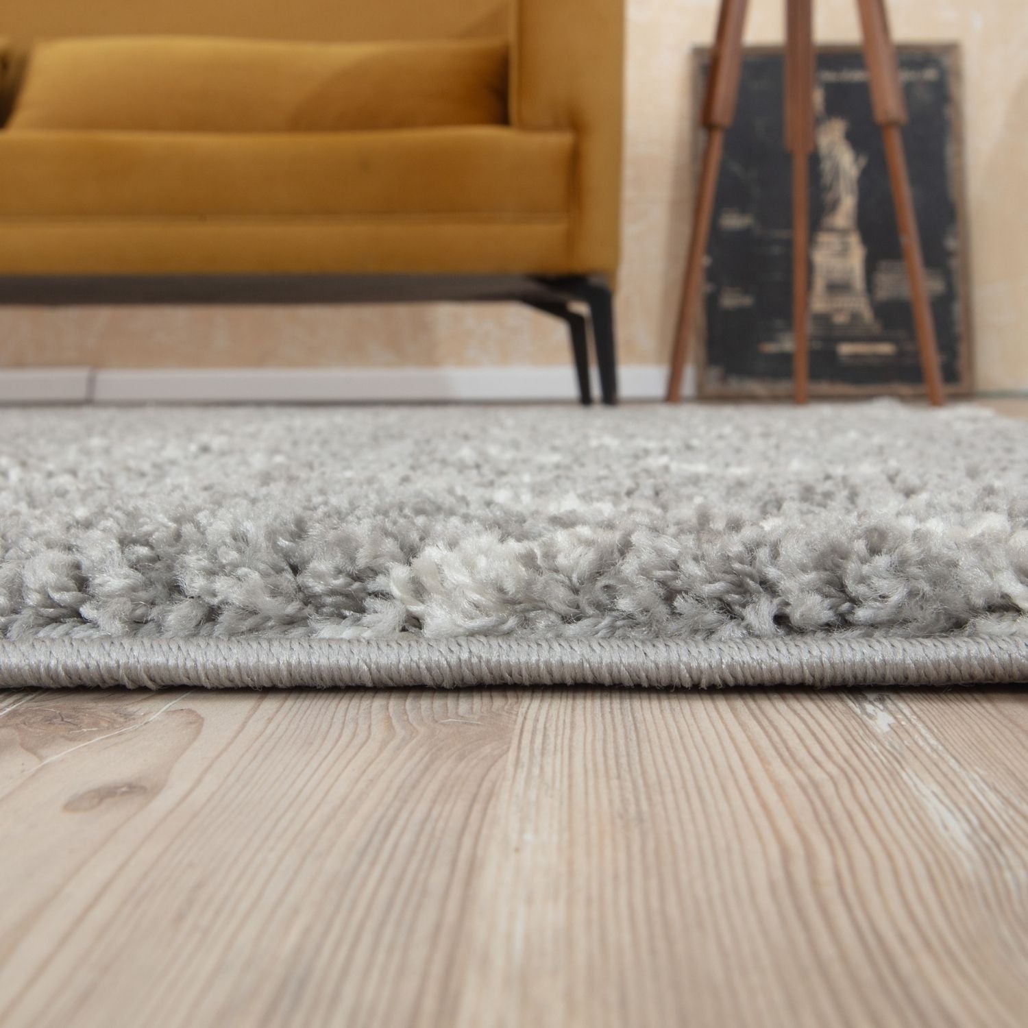 A plush moroccan grey shaggy rug with a soft textured surface and neatly stitched edges perfect for any room